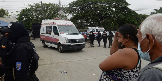 An Ambulance leaves the Litoral penitentiary the morning after riots broke out inside the jail in Guayaquil, Ecuador, Saturday, Nov. 13, 2021.