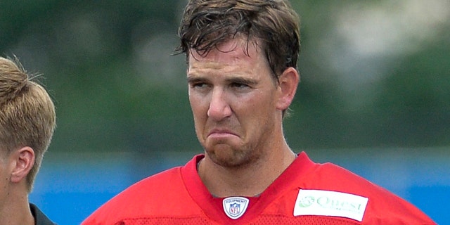 New York Giants quarterback Eli Manning (10) with a scowl on his face.New York Giants Training Camp @ Quest Diagnostics Training Center. Tuesday, July 22, 2014  in East Rutherford.