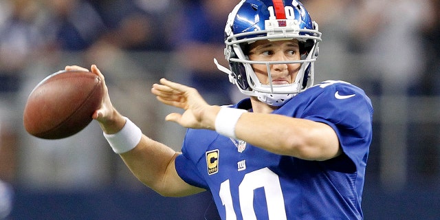 Giants quarterback Eli Manning warms up as New York Giants faced the Dallas Cowboys at AT&T Stadium in Arlington, Texas, on Sunday, September 8, 2013.