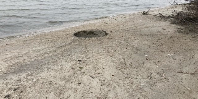 An explosion on Fox Island in New York left a crater