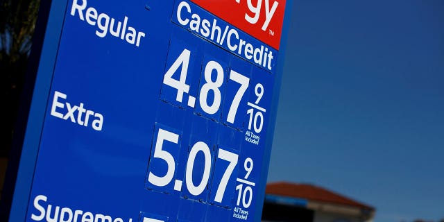 FILE PHOTO: Gas prices grow along with inflation as this sign at a gas station shows in San Diego, California, U.S. November, 9, 2021.