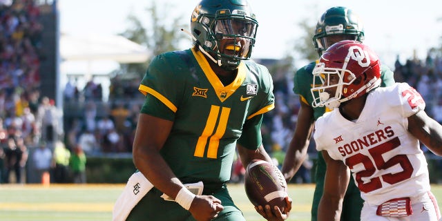 Baylor quarterback Gerry Bohanon scores on a 14-yard touchdown carry against the Oklahoma Sooners in Waco, Texas, on Nov. 13, 2021.