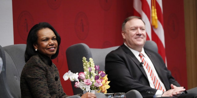 Condoleezza Rice, former U.S. secretary of state, and Mike Pompeo, U.S. secretary of state, right, listen during an event hosted by the Hoover Institution at Stanford University in Stanford, California, U.S., on Monday, Jan. 13, 2020. Pompeo is planning to attend a private dinner today with tech leaders including Oracle's Larry Ellison, according to people familiar with the matter. Photographer: John G. Mabanglo/EPA/Bloomberg via Getty Images