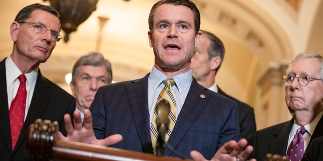 Republican Senatorial Committee Chairman Todd Young (R-IN) President Donald Trump and Vice President Mike Pence speak to reporters after a Senate Republican policy luncheon on March 10, 2020, in Washington, DC. (Photo by Samuel Corum / Getty Images)