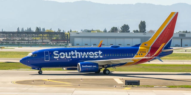 Southwest Airlines Boeing 737-700 aircraft seen at Norman Y. Mineta San Jose International Airport on Feb. 25, 2020. (Photo by Alex Tai/SOPA Images/LightRocket via Getty Images)