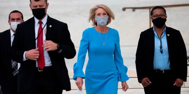 Secretary of Education Betsy DeVos arrives to pay her respects as Justice Ruth Bader Ginsburg lies in repose in front of the U.S. Supreme Court in Washington, D.C., on Sept. 24, 2020. (Photo by ANDREW CABALLERO-REYNOLDS / AFP)