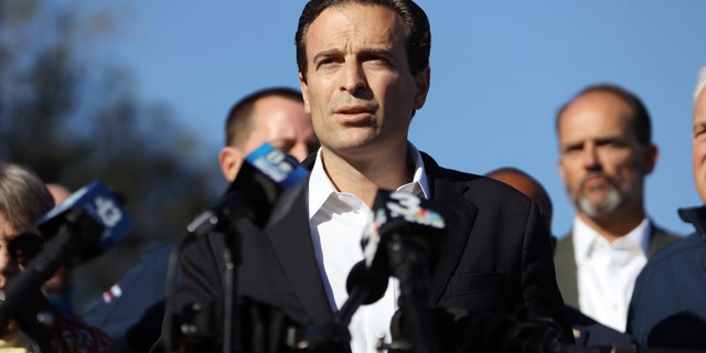 Adam Laxalt, Nevada's attorney general, center, speaks during a news conference hosted by the Trump Campaign outside the Clark County Election Department in Las Vegas, Nevada, U.S., on Thursday, Nov. 5, 2020. Photographer: Joe Buglewicz/Bloomberg via Getty Images