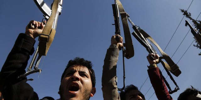 Supporters of Yemen's Huthi movement demonstrate in front of the closed U.S. Embassy in Sanaa on Jan. 18, 2021.