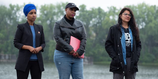 Reps. Ilhan Omar (from left), Ayanna Pressley and Rashida Tlaib listen during a news conference in Minneapolis, Minnesota, on Sept. 3, 2021. (Tim Evans/Bloomberg via Getty Images)