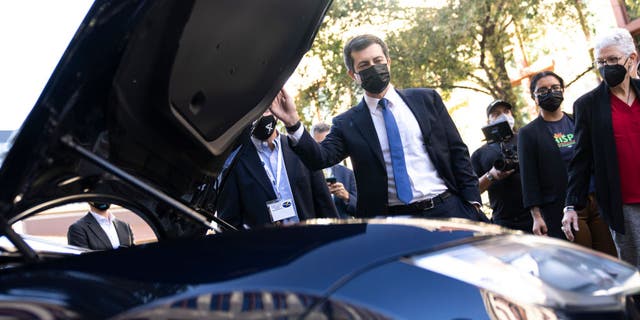 Pete Buttigieg looks at a Tesla Model S during an electric vehicles event outside the Department of Transportation on Oct. 20, 2021 in Washington, D.C. (Drew Angerer/Getty Images)