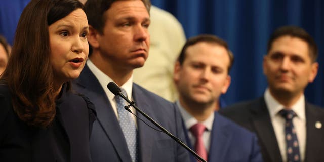 Florida Attorney General Ashley Moody and Florida Gov. Ron DeSantis at a news conference on April 19, 2021.