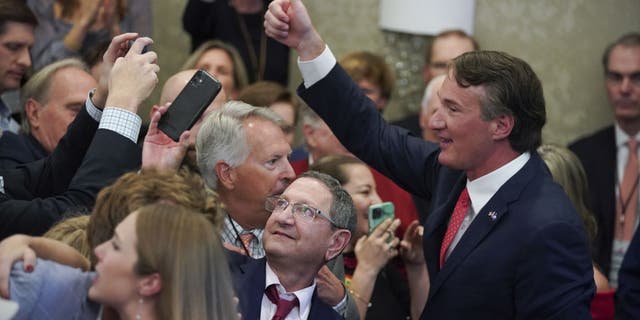 Glenn Youngkin, governor-elect of Virginia, gives a thumbs-up after speaking during an election night event in Chantilly, Virginia, U.S., on Wednesday, Nov. 3, 2021. (Photographer: Al Drago/Bloomberg via Getty Images)