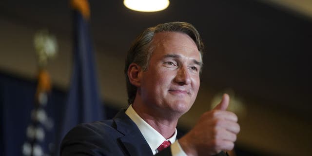 Glenn Youngkin, governor-elect of Virginia, gives a thumbs-up after speaking during an election night event in Chantilly, Virginia, U.S., on Wednesday, Nov. 3, 2021.(Photographer: Al Drago/Bloomberg via Getty Images)