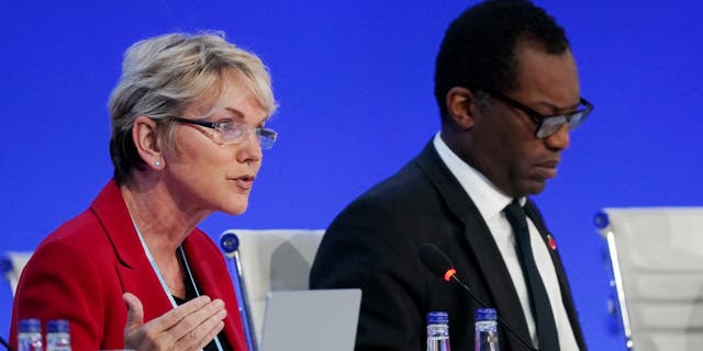 GLASGOW, SCOTLAND - NOVEMBER 04: U.S. Secretary of Energy Jennifer Granholm (L) and British Secretary of State for Business, Energy and Industrial Strategy Kwasi Kwarteng speak to delegates during day five of COP26 at SECC on November 3, 2021 in Glasgow, Scotland. Today COP26 will focus on accelerating the global transition to clean energy. The 2021 climate summit in Glasgow is the 26th "Conference of the Parties" and represents a gathering of all the countries signed on to the U.N. Framework Convention on Climate Change and the Paris Climate Agreement. The aim of this year's conference is to commit countries to net zero carbon emissions by 2050. (Photo by Ian Forsyth/Getty Images)