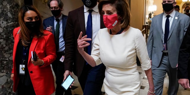 Speaker of the House Nancy Pelosi, D-Calif., speaks to reporters as House Democrats work on infrastructure and spending bills on Capitol Hill on November 4, 2021 in Washington, DC. Democratic moderates and progressives continue to negotiate on the Build Back Better social spending bill.