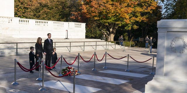 Sen. Tom Cotton, R-Ark., and his family, stand after placing flowers during a centennial commemoration event at the Tomb of the Unknown Soldier in Arlington National Cemetery on Nov. 9, 2021, in Arlington, Virginia. 