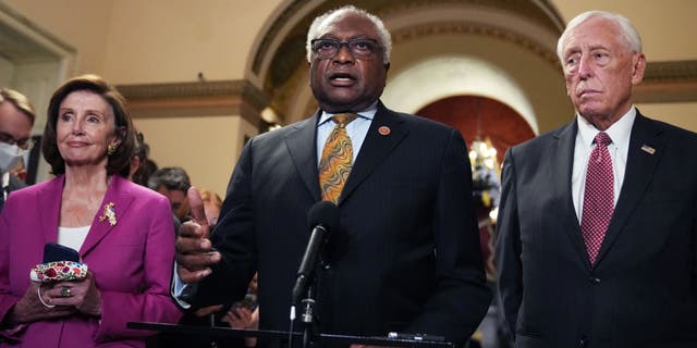 House Majority Whip Jim Clyburn, Speaker of the House Nancy Pelosi, and House Majority Leader Steny Hoyer, conduct a news conference at the Capitol on Nov. 5, 2021. (Tom Williams/CQ-Roll Call, Inc via Getty Images)