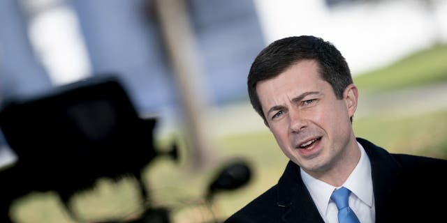 Transportation Secretary Pete Buttigieg during a TV interview outside the White House in Washington, D.C., on Monday, Nov. 15, 2021. (Stefani Reynolds/Bloomberg via Getty Images)