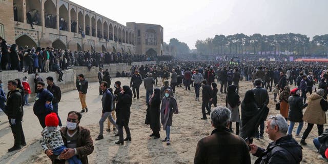 Iranians gather during a protest to voice their anger after their province's lifeblood river dried up due to drought and diversion, in the central city of Isfahan, on November 19, 2021. - The massive protest, that drew in farmers and other people from across Isfahan province, was the biggest since demonstrations over the water crisis started on November 9. (Photo by Fatmeh Nasr / ISNA / AFP) (Photo by FATMEH NASR/ISNA/AFP via Getty Images)