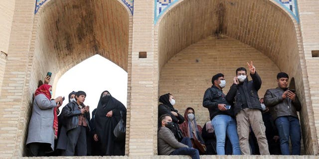 Iranians gather during a protest to voice their anger after their province's lifeblood river dried up due to drought and diversion, in the central city of Isfahan, on November 19, 2021. - The massive protest, which drew in farmers and other people from across Isfahan province, was the biggest since demonstrations over the water crisis started on November 9. (Photo by Fatmeh Nasr / ISNA / AFP) (Photo by FATMEH NASR/ISNA/AFP via Getty Images)