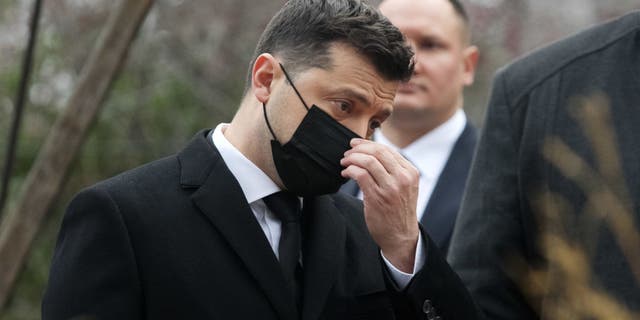 Ukrainian President Volodymyr Zelensky takes part at a commemoration ceremony at a monument of Heroes of Heavenly Hundred, activists who were killed during the anti-government protest the Euro Maidan revolution in 2014, in Kyiv, Ukraine, in November 2021. (STR/NurPhoto via Getty Images)