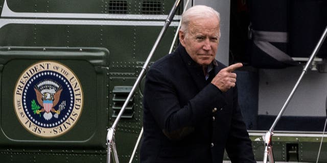 US President Joe Biden points before walking to the Oval office after getting off Marine One on the South Lawn of the White House in Washington, DC on November 21, 2021. (Photo by ANDREW CABALLERO-REYNOLDS/AFP via Getty Images)