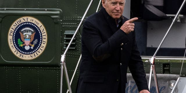 US President Joe Biden points before walking to the Oval office after getting off Marine One on the South Lawn of the White House in Washington, DC on November 21, 2021. (Photo by ANDREW CABALLERO-REYNOLDS/AFP via Getty Images)