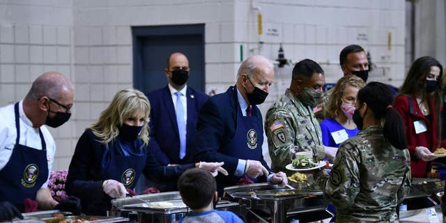 President Biden and first lady Jill Biden serve food to soldiers and their families at Fort Bragg.