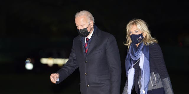 President Biden, left, and first lady Jill Biden walk on the South Lawn of the White House after arriving on Marine One in Washington, D.C., on Monday, Nov. 22, 2021. (Photographer: Yuri Gripas/Abaca/Bloomberg via Getty Images)