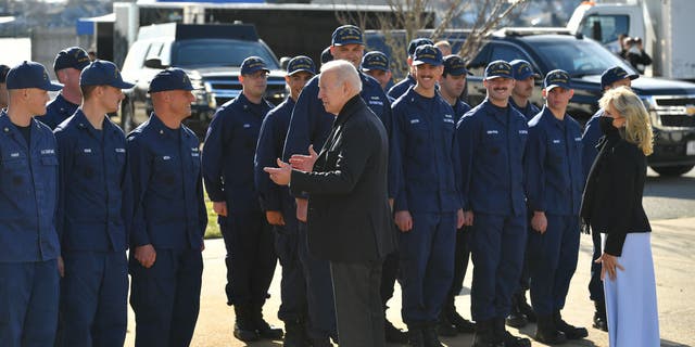 President Biden and first lady Jill Biden greet members of the Coast Guard. (Photo by MANDEL NGAN/AFP via Getty Images)