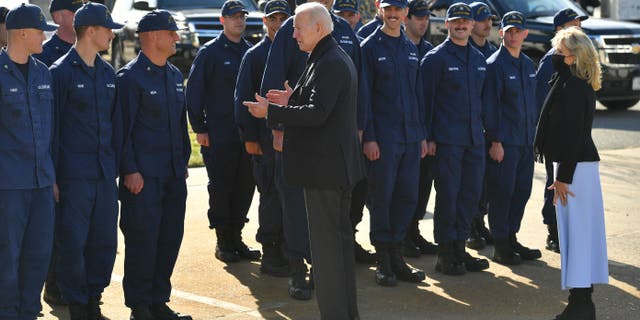 President Biden and first lady Jill Biden greet members of the Coast Guard. (Photo by MANDEL NGAN/AFP via Getty Images)