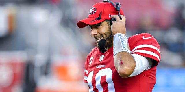 San Francisco 49ers quarterback Jimmy Garoppolo gets a headset on for his post game interview at the game between the Minnesota Vikings and the San Francisco 49ers on Sunday, Nov. 28, 2021 at Levi's Stadium in Santa Clara, California. 