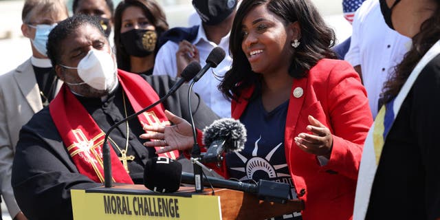 Texas state Reps. Jasmine Crockett (D-District 100) speaks alongside Rev. William Barber, Co-Chair of the Poor People’s Campaign, and fellow representatives, as they prepare to deliver a petition to Senate Majority Leader Charles Schumer calling for an end to the filibuster, the passage of the For The People Act and restoring the Voting Rights Act, at the U.S. Supreme Court on August 12, 2021 in Washington, D.C.