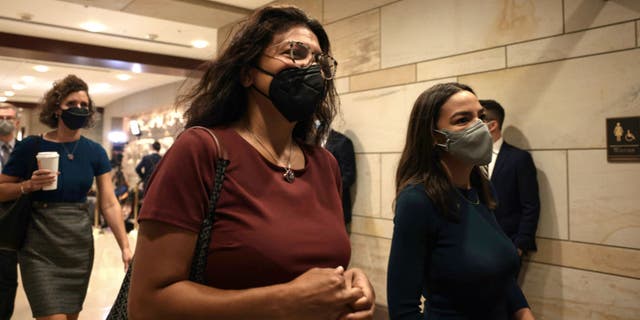 Reps. Rashida Tlaib (left) and Alexandria Ocasio-Cortez arrive for a briefing on Afghanistan at the Capitol on Aug. 24, 2021. (Anna Moneymaker/Getty Images)