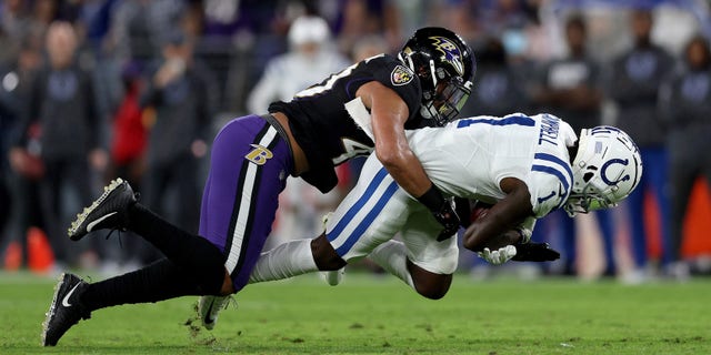 BALTIMORE, MARYLAND - OCTOBER 11: Parris Campbell #1 of the Indianapolis Colts is tackled by Malik Harrison #40 of the Baltimore Ravens during the first quarter in a game at M&T Bank Stadium on October 11, 2021 in Baltimore, Maryland. (Photo by Patrick Smith/Getty Images)