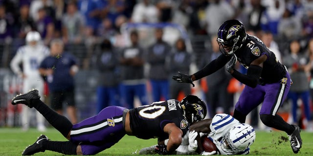 BALTIMORE, MARYLAND - OCTOBER 11: Parris Campbell #1 of the Indianapolis Colts is tackled by Malik Harrison #40 of the Baltimore Ravens during the first quarter in a game  at M&amp;amp;T Bank Stadium on October 11, 2021 in Baltimore, Maryland. (Photo by Patrick Smith/Getty Images)
