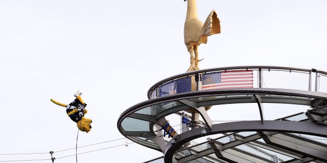 The Jacksonville Jaguars' mascot Jaxson de Ville jumps off the roof of the stadium during the NFL London 2021 match against the Miami Dolphins on Oct. 17, 2021, in England.