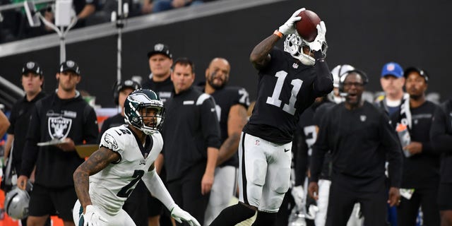 LAS VEGAS, NEVADA - OCTOBER 24: Henry Ruggs III #11 of the Las Vegas Raiders catches the ball as Darius Slay #2 of the Philadelphia Eagles defends during a game at Allegiant Stadium on October 24, 2021 in Las Vegas, Nevada. (Photo by Sam Morris/Getty Images)