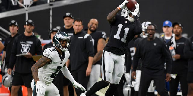 LAS VEGAS, NEVADA - OCTOBER 24: Henry Ruggs III #11 of the Las Vegas Raiders catches the ball as Darius Slay #2 of the Philadelphia Eagles defends during a game at Allegiant Stadium on October 24, 2021 in Las Vegas, Nevada. (Photo by Sam Morris/Getty Images)