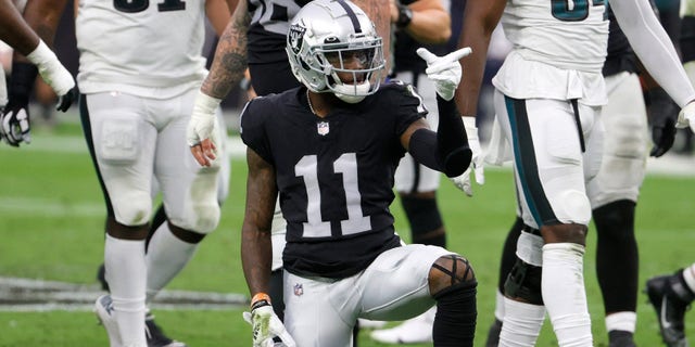 LAS VEGAS, NEVADA - OCTOBER 24: Wide receiver Henry Ruggs III #11 of the Las Vegas Raiders spins the ball on the ground and gestures as he celebrates a catch for a first down against the Philadelphia Eagles during their game at Allegiant Stadium on October 24, 2021 in Las Vegas, Nevada. The Raiders defeated the Eagles 33-22. (Photo by Ethan Miller/Getty Images)