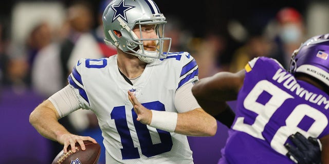 MINNEAPOLIS, MINNESOTA - OCTOBER 31: Cooper Rush #10 of the Dallas Cowboys throws a pass against the Minnesota Vikings at U.S. Bank Stadium on October 31, 2021 in Minneapolis, Minnesota. (Photo by Adam Bettcher/Getty Images)