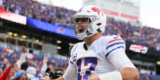 Josh Allen of the Buffalo Bills celebrates after a touchdown run during the fourth quarter against the Miami Dolphins at Highmark Stadium Oct. 31, 2021, in Orchard Park, N.Y. 