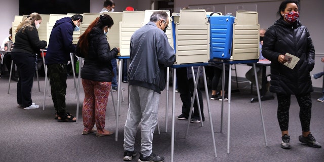 Voters cast ballots at the Fairfax County Government Center on November 02, 2021 in Fairfax, Virginia.