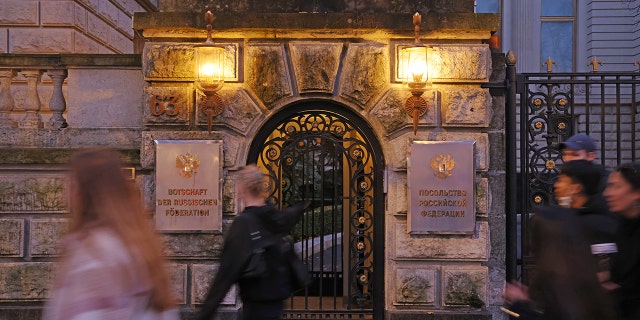 BERLIN, GERMANY - NOVEMBER 05: People walk past the Russian Embassy on November 05, 2021 in Berlin, Germany. A Russian diplomat of the embassy was reportedly found dead on the sidewalk in front of the embassy on October 19, apparently after having fallen from a window. Media are reporting that the man, 35, was an agent of the FSB, Russia's intelligence agency, and the son of a high-ranking FSB official. (Photo by Sean Gallup/Getty Images)