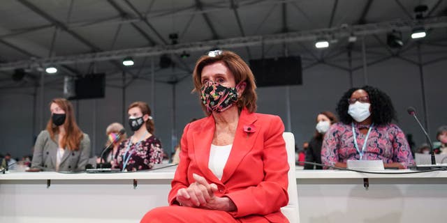 Speaker Nancy Pelosi waits to be introduced to speak on stage in Plenary 2 during COP26 on Nov. 9, 2021 in Glasgow, Scotland. (Photo by Ian Forsyth/Getty Images)