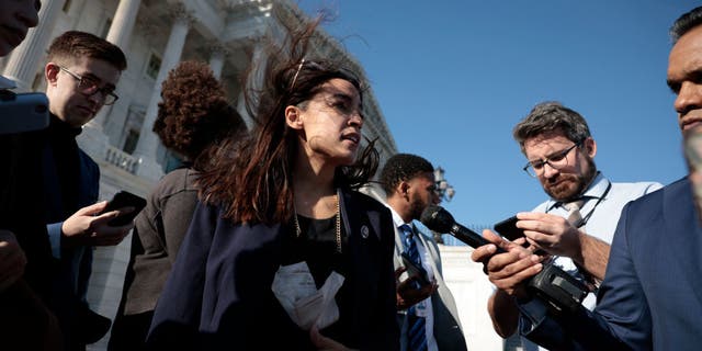 Rep. Alexandria Ocasio-Cortez speaks with reporters outside the Capitol in Washington on Nov. 18, 2021. (Anna Moneymaker/Getty Images)