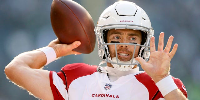 Colt McCoy (12) of the Arizona Cardinals warms up before the game against the Seattle Seahawks on November 21, 2021 at Lumen Field in Seattle, Washington.