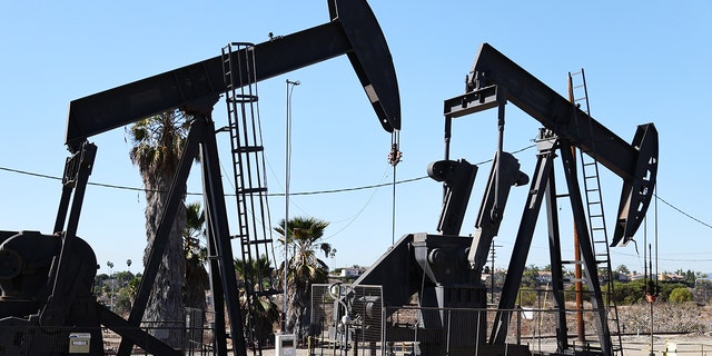 Oil pumpjacks stand at the Inglewood Oil Field in Los Angeles.