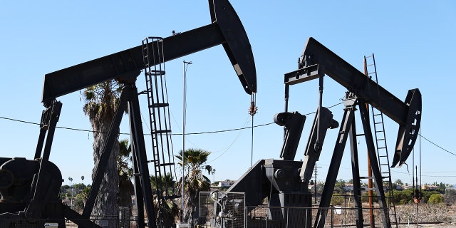 Oil pumpjacks stand in the Inglewood Oil Field in Los Angeles.