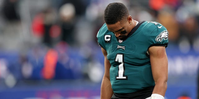 Jalen Hurts of the Philadelphia Eagles hangs his head as he walks off the field after his team's loss against the New York Giants at MetLife Stadium Nov. 28, 2021 a East Rutherford, N.J. 